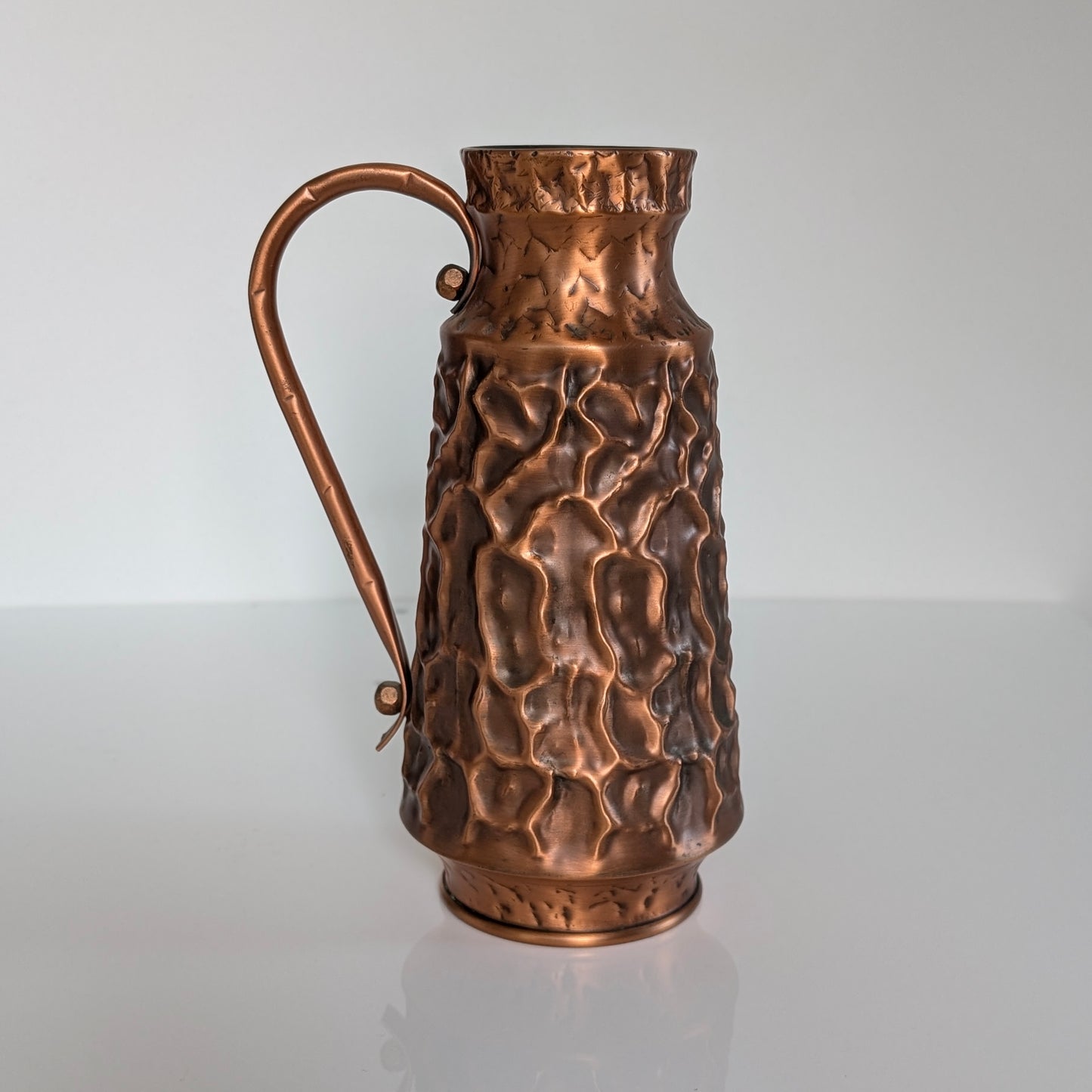 A Mid Century Textured Copper Jug