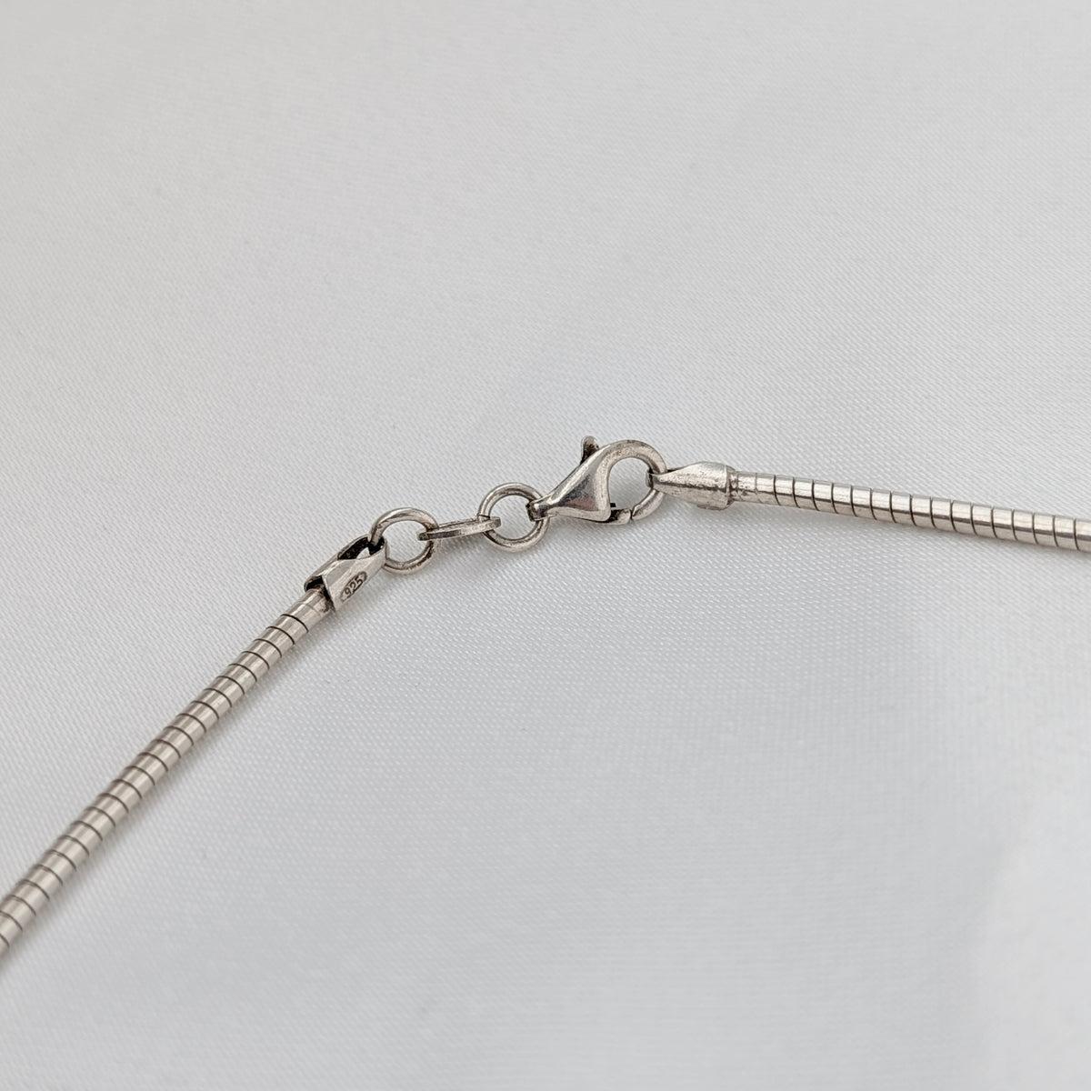 A Modernist Sterling Silver Pendant on Omega Chain