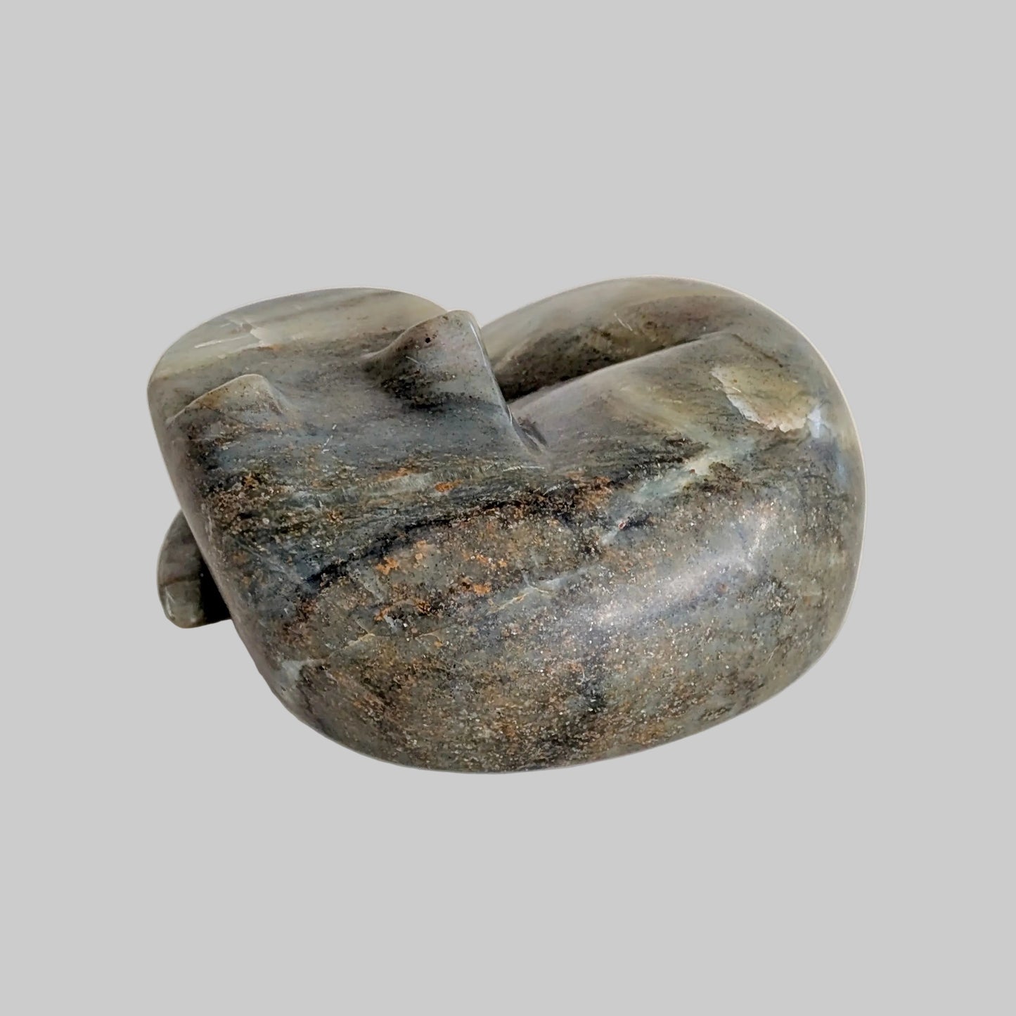 A Carved Soapstone Sleeping Fox Sculpture
