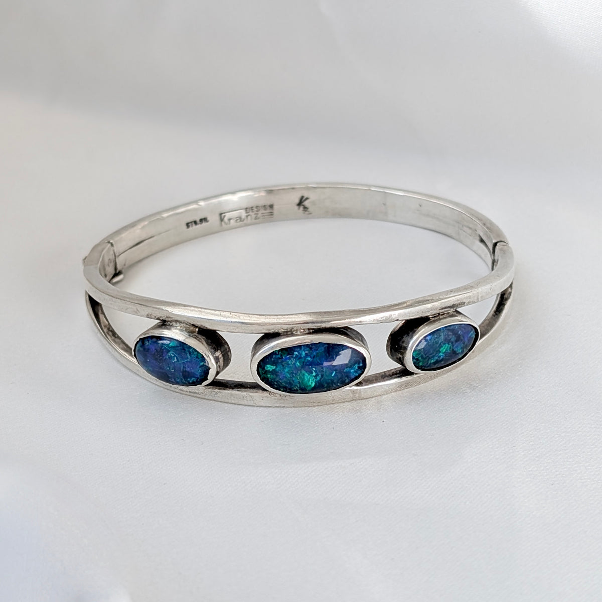 A Kranz & Ziegler Sterling Silver Australian Opal Bangle