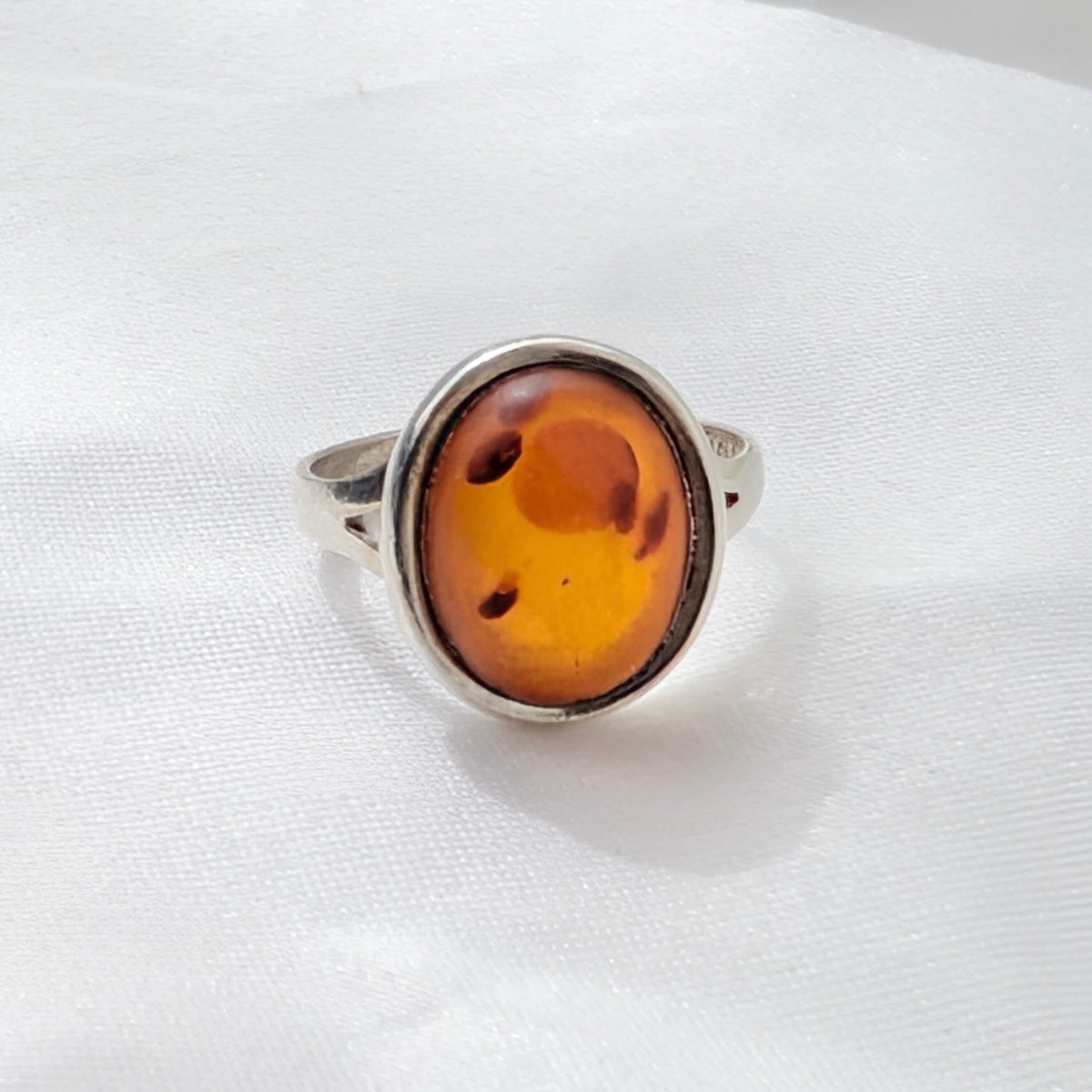 A Modernist Sterling Silver Baltic Amber Ring by Hermann Siersbøl, circa 1960