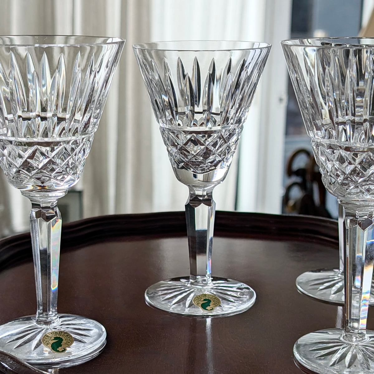 A Set of Four Waterford Cut Crystal "Maeve" White Wine Glasses