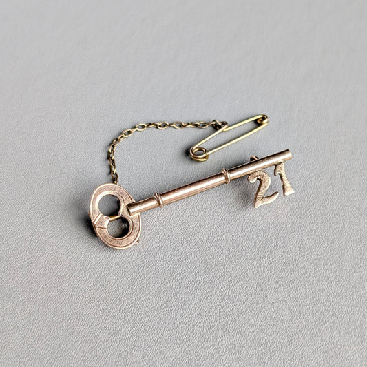 An Australian 9ct Rose Gold "21" Key Brooch, c1900
