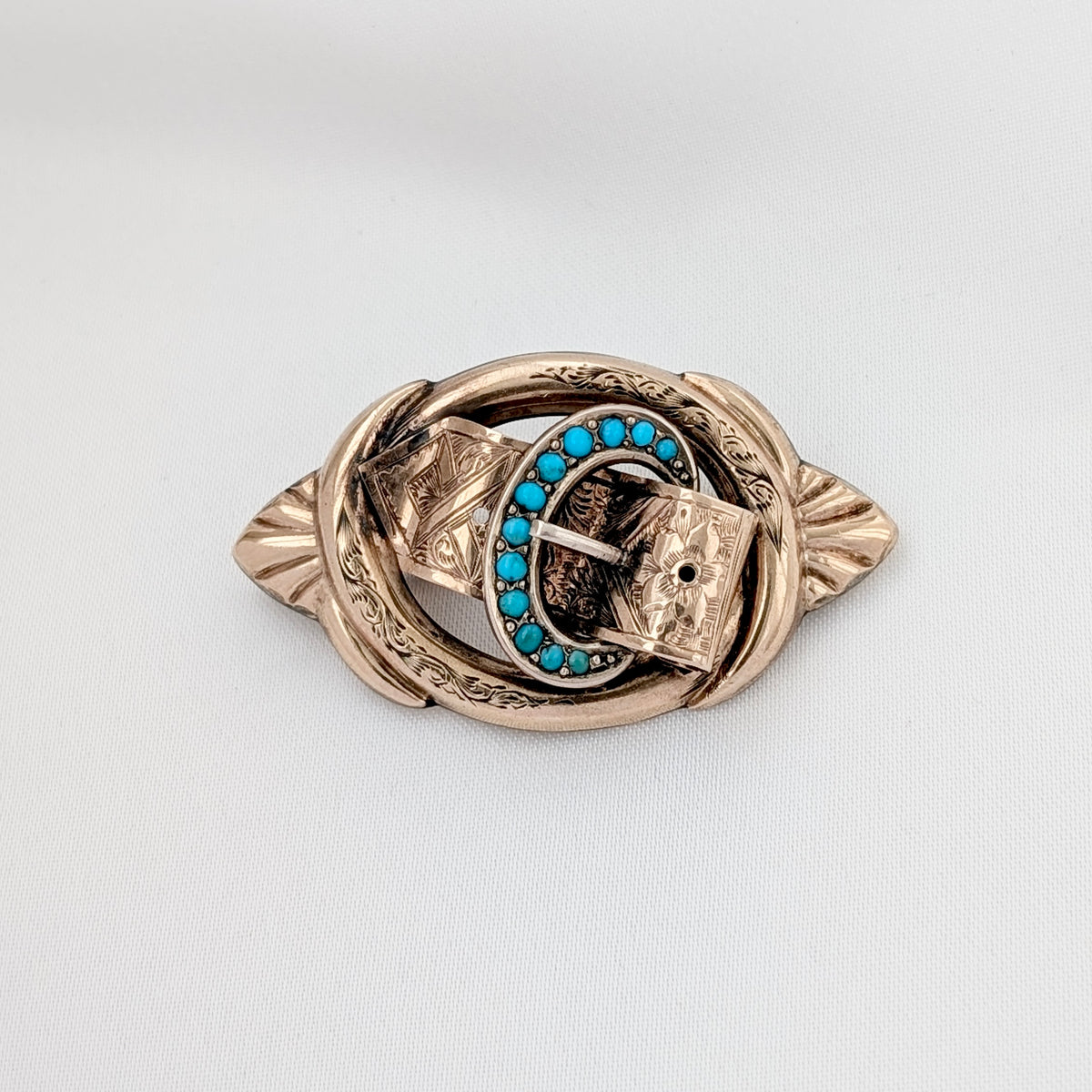 A Victorian 9ct Gold-Cased Turquoise "Buckle" Brooch, circa 1860