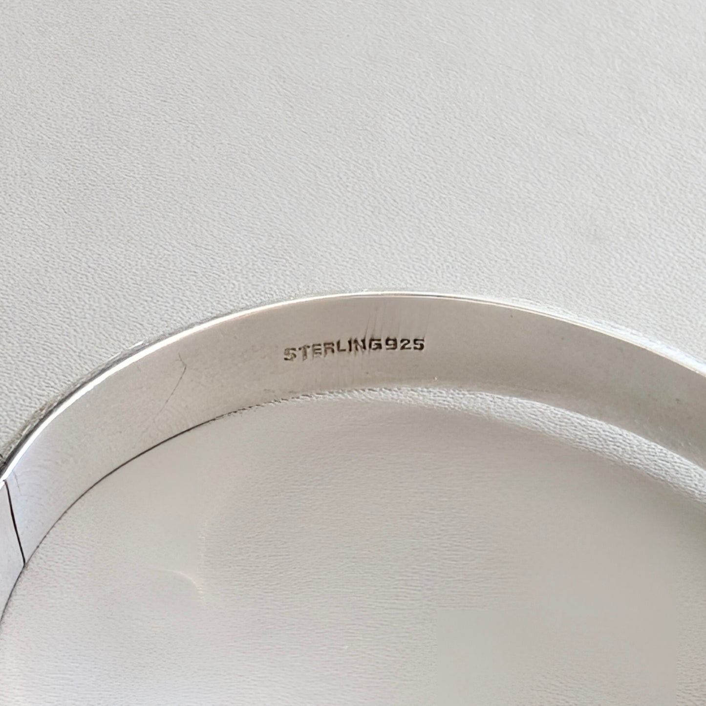 A Hinged Sterling Silver Bangle with Engraved Design