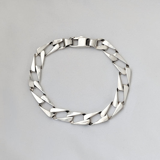 A Modernist Sterling Silver Faceted Curb Link Bracelet