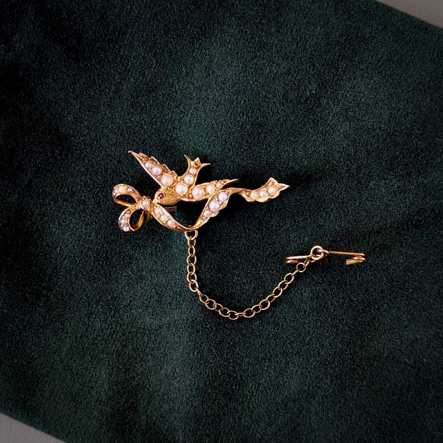An Australian 15ct Gold Seed Pearl & Ruby Bird Brooch, c1900