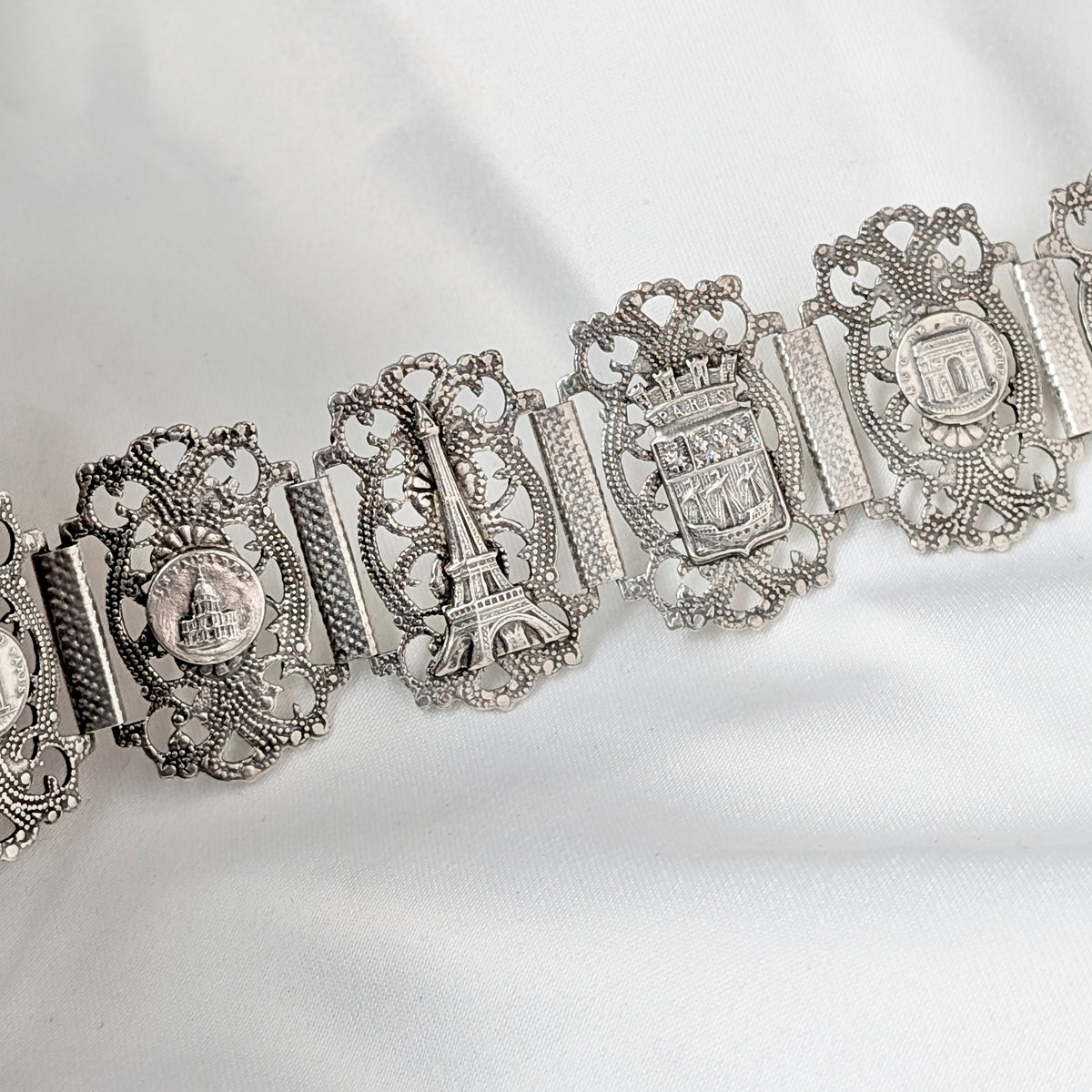 A Substantial French Parisien Travel Charm Bracelet in Silver Plate, circa 1940