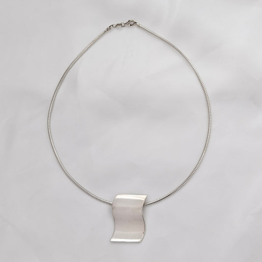 A Modernist Sterling Silver Pendant on Omega Chain