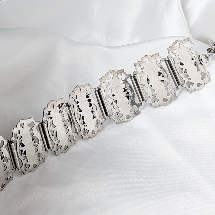 A Substantial French Parisien Travel Charm Bracelet in Silver Plate, circa 1940