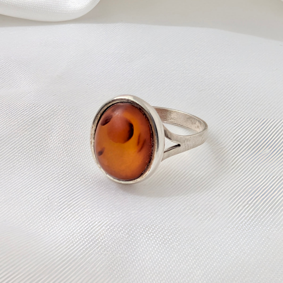 A Modernist Sterling Silver Baltic Amber Ring by Hermann Siersbøl, circa 1960