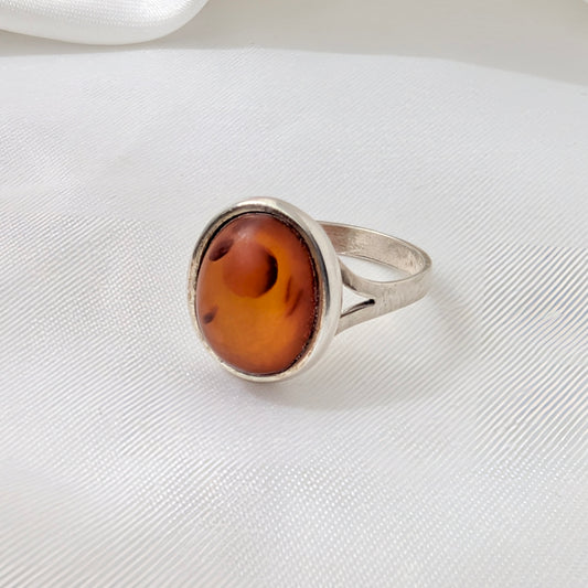 A Modernist Sterling Silver Baltic Amber Ring by Hermann Siersbøl, circa 1960