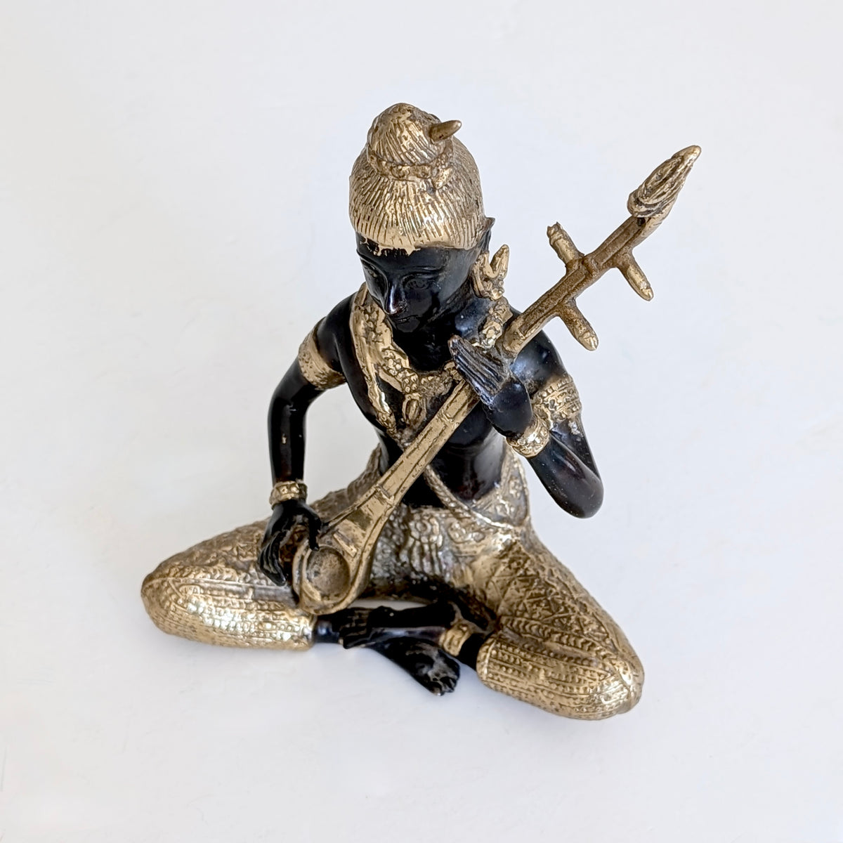 A Thai Gilt Bronze Celestial Musician, c1970's