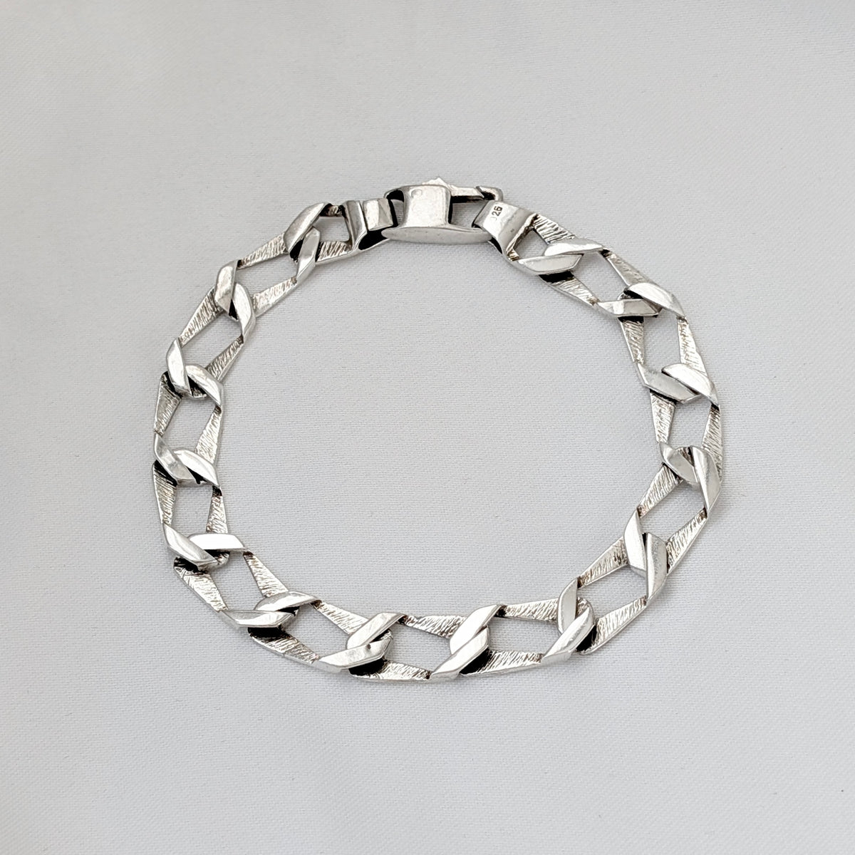 A Modernist Sterling Silver Faceted Curb Link Bracelet